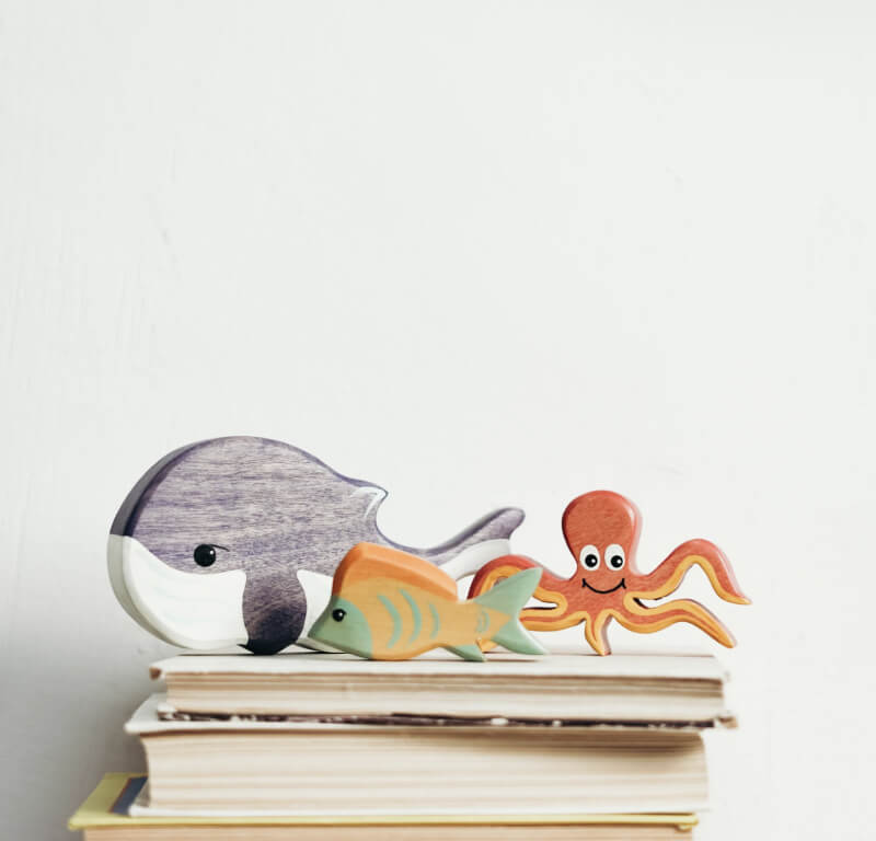 Wooden whale, fish, and octopus